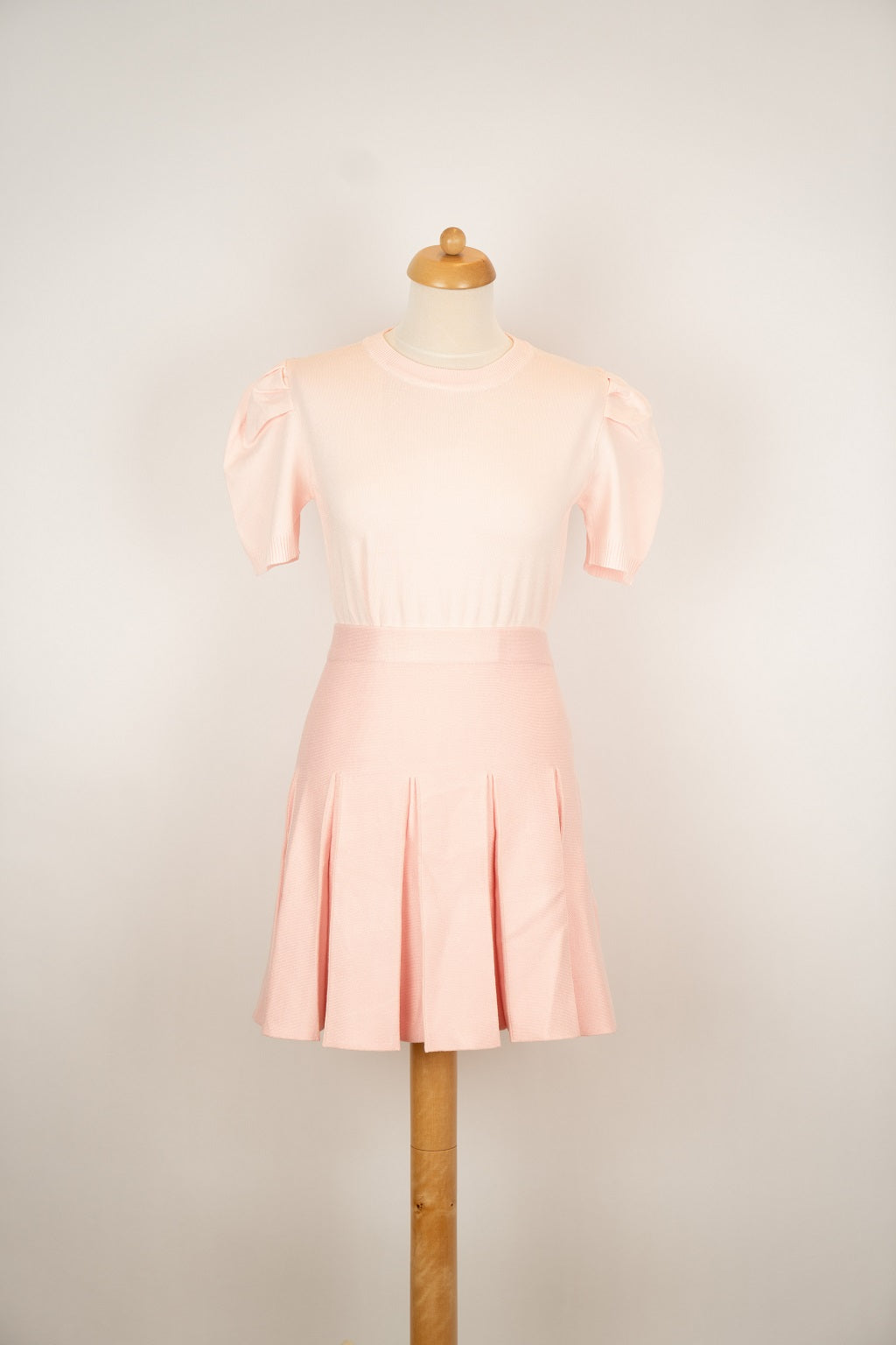 Roze gebreid plooirokje
