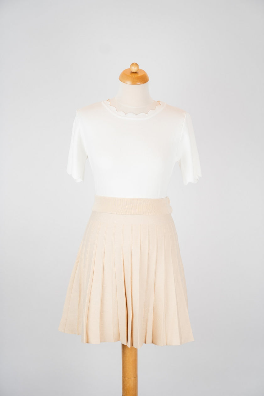 Beige klokkend rokje met plooien