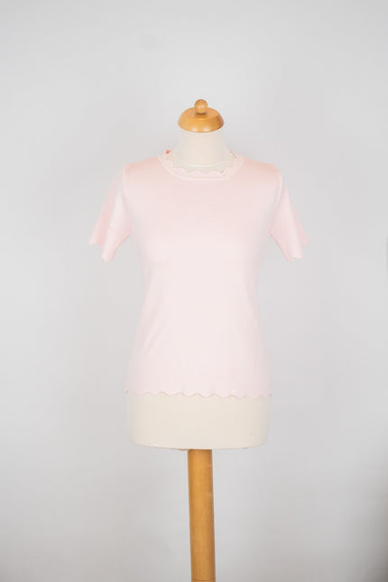 Roze truitje met schulpdetails