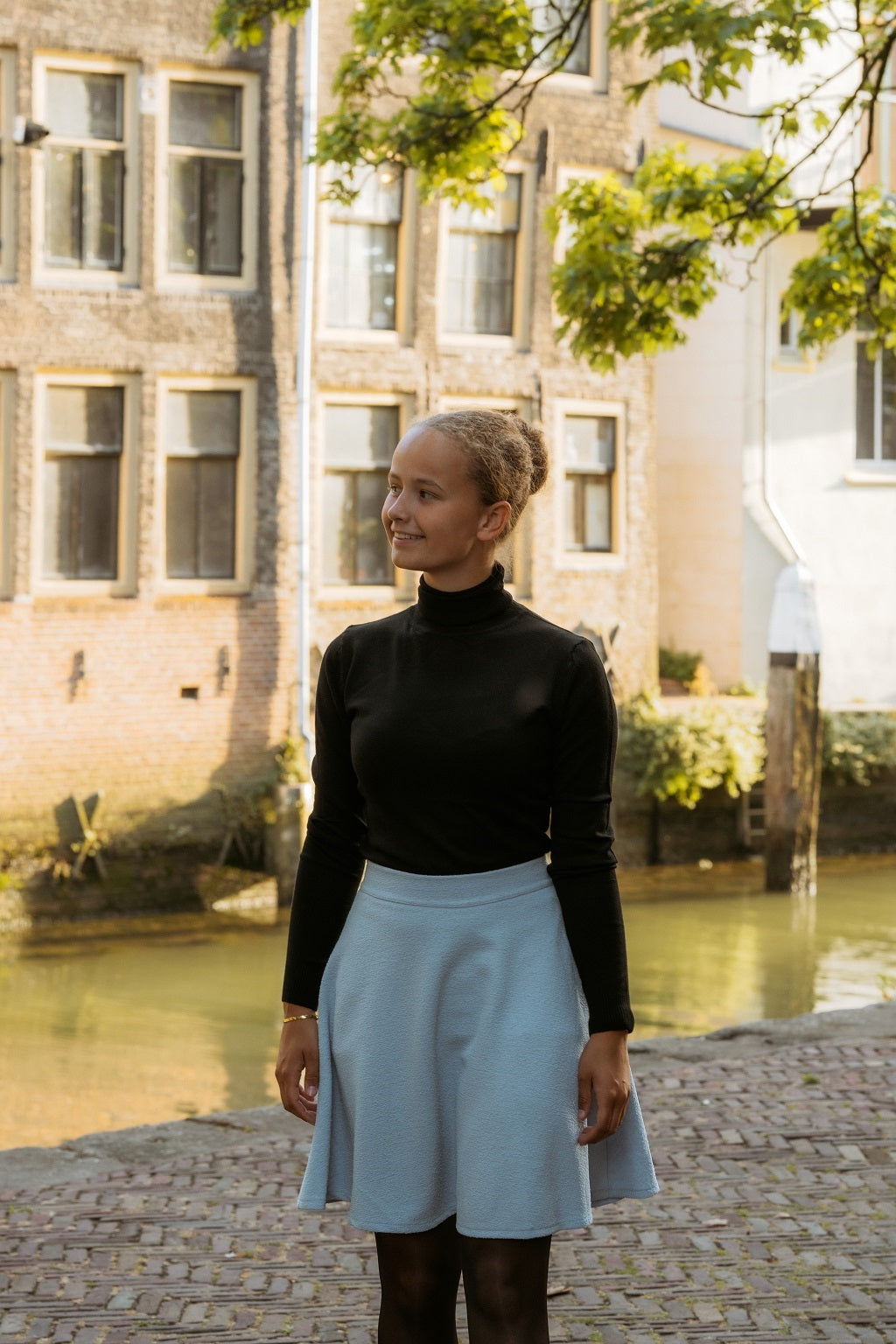 Lichtblauw klokkend bouclé rokje