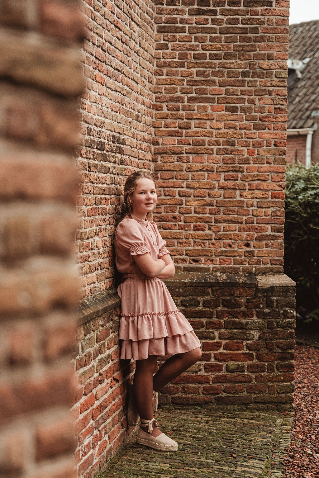 Roze jurkje met gesmokt boord en knoopjes