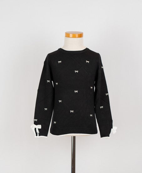 Zwart truitje met strikjes