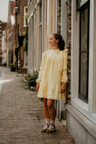 Gele jurk met strik, lange mouw