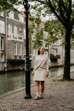 Zandkleur rokje met plooitjes