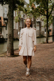 Zandkleur jurk met strik, lange mouw