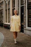 Gele jurk met strik, lange mouw