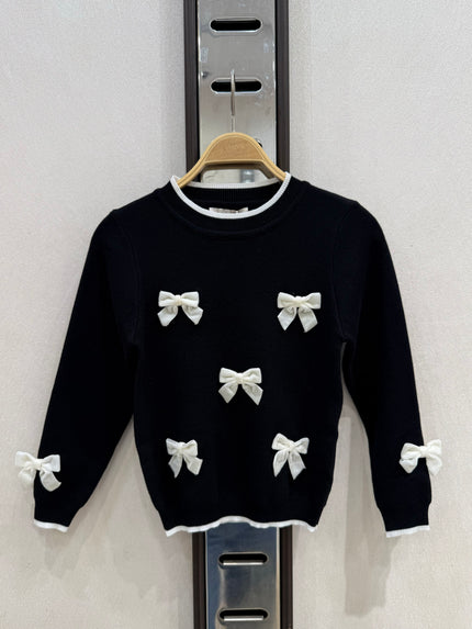 Zwart truitje met strikken