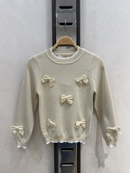 Zandkleur truitje met strikken