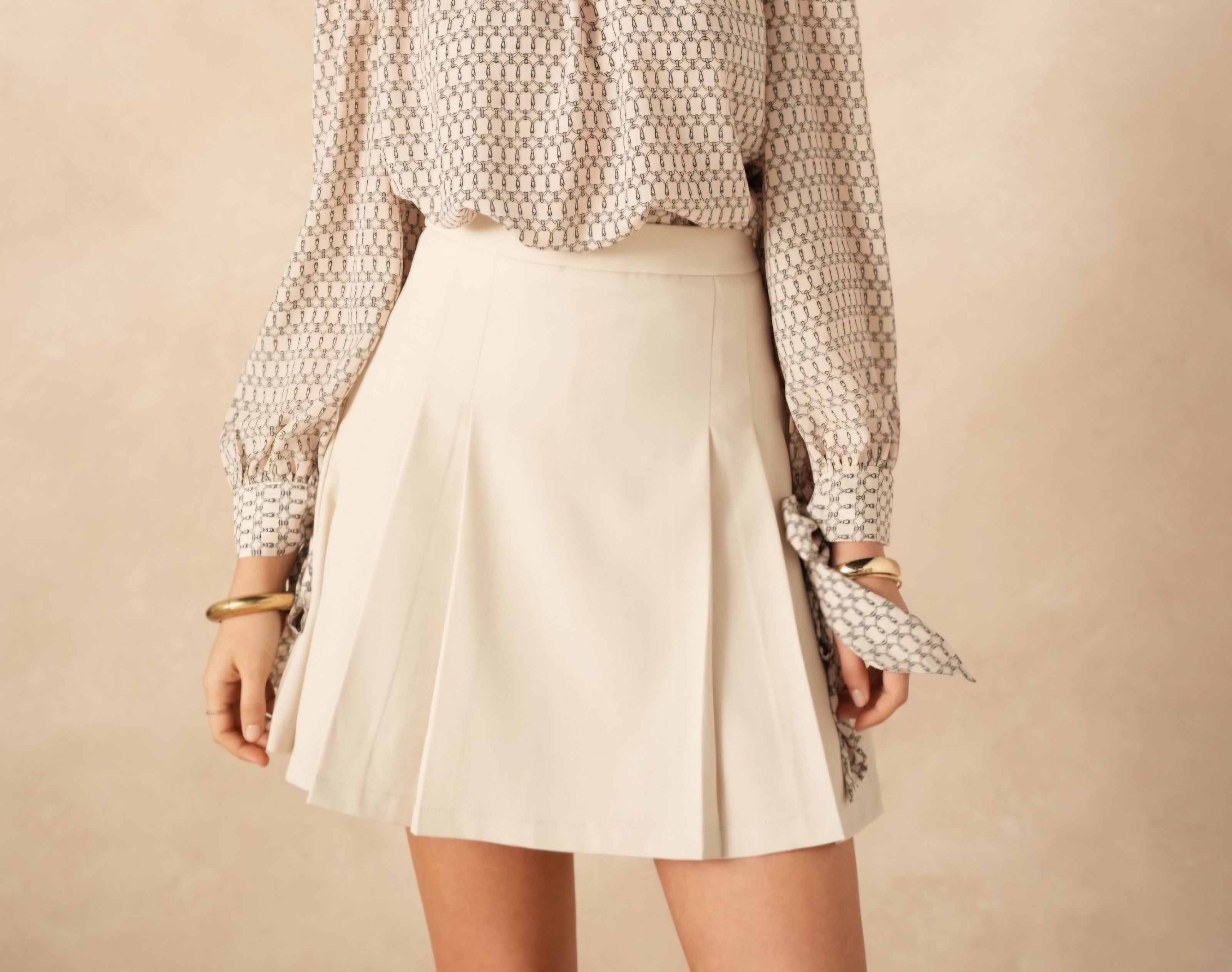 Zandkleur rokje met plooitjes