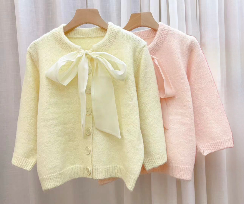 Roze vestje met strik