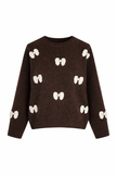 Bruine trui met offwhite strikken