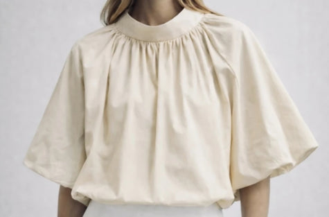 Zandkleur blouse/top met strik in de nek