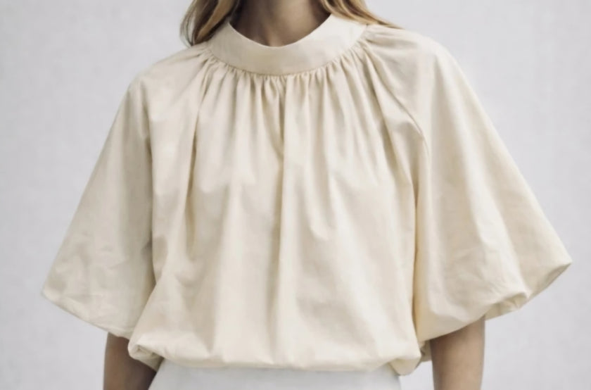 Zandkleur blouse/top met strik in de nek